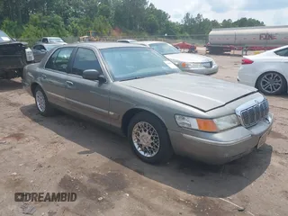 2000 Mercury Grand Marquis GS z VIN 2MEFM74W9YX616362, wystawiony jako IAAI lot #42385961 z przebiegiem 131 902 mil mil oraz . Historia ofert i sprzedaży dostępna na DreamBid. Obrazek 1.
