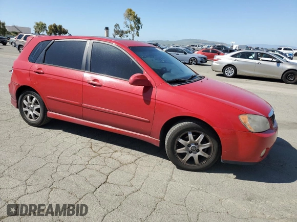 2005 Kia Spectra with VIN KNAFE162455069422, listed as a Copart auction lot 52999455 with 249,774 mi miles and Salvage Title. Bid and sale history available at carsss.com. Image 4.
