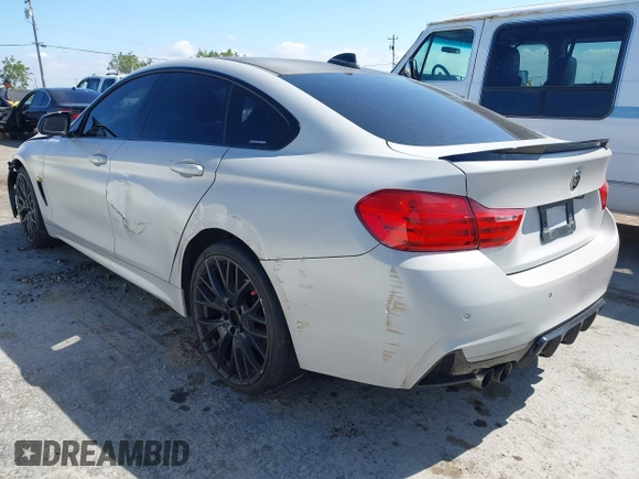 2015 BMW 4 Series 428i xDrive with VIN WBA4C9C54FD330582, listed as a IAAI auction lot 42135691 with 127,289 mi miles and . Bid and sale history available at DreamBid. Image 3.