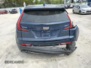 2022 Cadillac XT4 FWD Luxury z VIN 1GYAZAR47NF120348, wystawiony jako Copart lot #50187025 z przebiegiem 76 886 mil mil oraz Nie do naprawy • Non repairable. Historia ofert i sprzedaży dostępna na DreamBid. Obrazek 6.