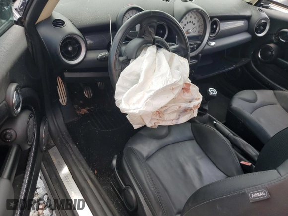 2011 MINI Hardtop S with VIN WMWSV3C55BTY20530, listed as a Copart auction lot 56016985 with Not Provided miles and Salvage Title. Bid and sale history available at DreamBid. Image 8.