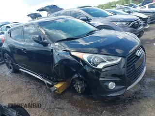 2013 Hyundai Veloster Turbo with VIN KMHTC6AE5DU143733, listed as a IAAI auction lot 42116317 with 116,155 mi miles and . Bid and sale history available at DreamBid. Image 1.
