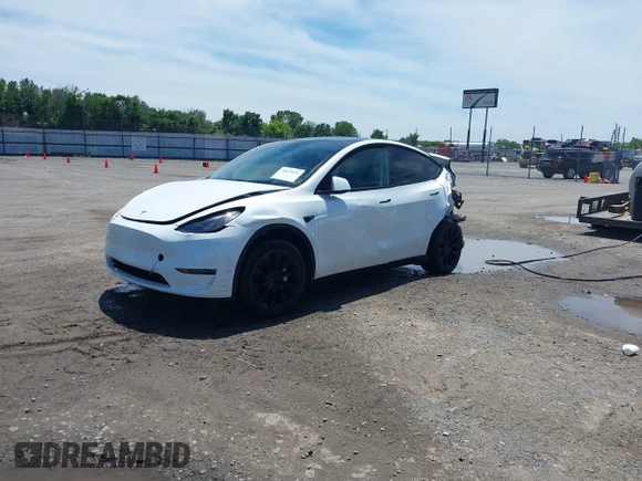 2023 Tesla Model Y Long Range z VIN 7SAYGDEE9PF753051, wystawiony jako IAAI lot #39615839 z przebiegiem Nie podano mil oraz . Historia ofert i sprzedaży dostępna na DreamBid. Obrazek 18.