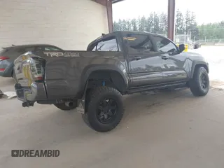 2019 Toyota Tacoma SR z VIN 3TMCZ5AN1KM257081, wystawiony jako IAAI lot #42211385 z przebiegiem 60 229 mil mil oraz . Historia ofert i sprzedaży dostępna na DreamBid. Obrazek 4.