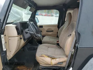 2000 Jeep Wrangler Sport with VIN 1J4FA49S9YP743515, listed as a Copart auction lot 53906305 with 247,349 mi miles and Salvage title. Bid and sale history available at DreamBid. Image 7.