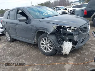 2015 Mazda CX-5 Touring with VIN JM3KE2CY2F0461935, listed as a IAAI auction lot 41430070 with 220,857 mi miles and . Bid and sale history available at carsss.com. Image 1.