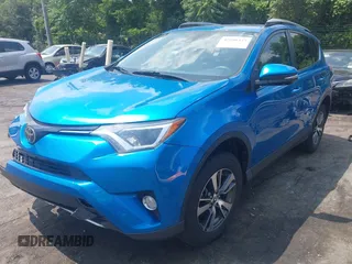 2018 Toyota RAV4 XLE with VIN JTMWFREVXJJ751586, listed as a IAAI auction lot 42586337 with 55,821 mi miles and . Bid and sale history available at DreamBid. Image 2.