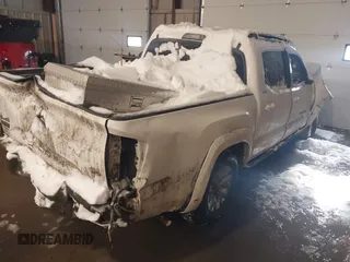 2016 Toyota Tacoma SR with VIN 3TMCZ5AN5GM004885, listed as a IAAI auction lot 41569409 with 143,951 mi miles. Bid and sale history available at carsss.com. Image 4.