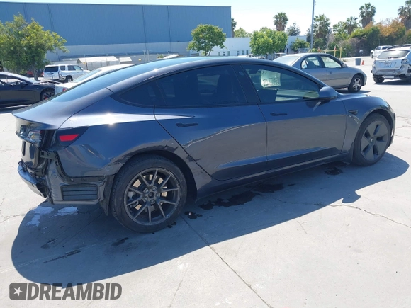 2023 Tesla Model 3 with VIN 5YJ3E1EAXPF405588, listed as a IAAI auction lot 42348952 with 30,788 mi miles and . Bid and sale history available at DreamBid. Image 4.