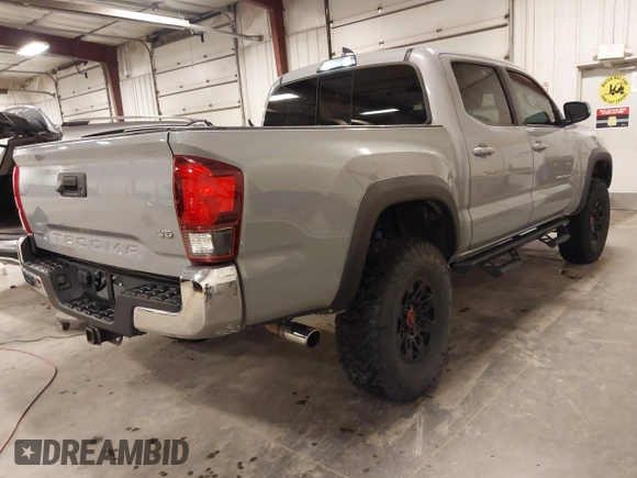 2019 Toyota Tacoma SR z VIN 3TMCZ5AN1KM232360, wystawiony jako IAAI lot #42006355 z przebiegiem 133 909 mil mil oraz . Historia ofert i sprzedaży dostępna na DreamBid. Obrazek 4.