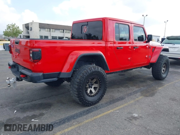 2021 Jeep Gladiator Rubicon with VIN 1C6JJTBGXML572976, listed as a IAAI auction lot 42134909 with 35,612 mi miles and . Bid and sale history available at DreamBid. Image 4.