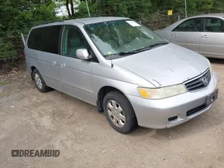 2002 Honda Odyssey EX-L z VIN 2HKRL18902H548707, wystawiony jako IAAI lot #42491692 z przebiegiem 256 684 mil mil oraz . Historia ofert i sprzedaży dostępna na DreamBid. Obrazek 1.