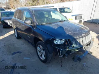 2014 Jeep Compass Latitude with VIN 1C4NJCEB3ED560058, listed as a IAAI auction lot 41470125 with 116,319 mi miles. Bid and sale history available at carsss.com. Image 1.