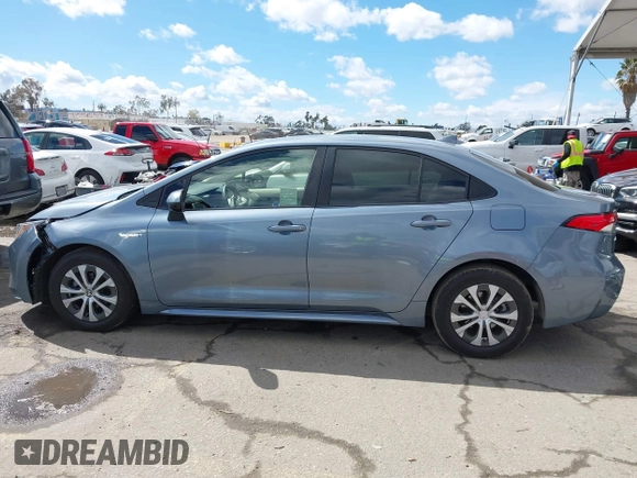 2021 Toyota Corolla Hybrid LE with VIN JTDEAMDE0MJ026601, listed as a IAAI auction lot 41797452 with 85,294 mi miles. Bid and sale history available at carsss.com. Image 14.