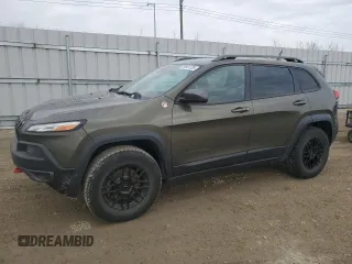 2015 Jeep Cherokee Trailhawk with VIN 1C4PJMBS0FW678738, listed as a Copart auction lot 50651235 with 147,793 mi miles and Salvage title. Bid and sale history available at DreamBid. Image 1.
