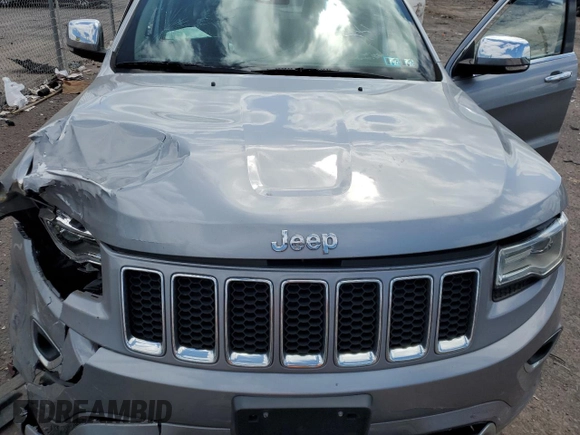2015 Jeep Grand Cherokee Overland with VIN 1C4RJFCG3FC880084, listed as a Copart auction lot 57291165 with 112,442 mi miles and Salvage title. Bid and sale history available at DreamBid. Image 12.