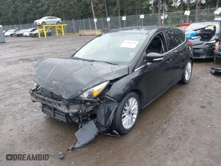 2015 Ford Focus Titanium with VIN 1FADP3N2XFL300859, listed as a IAAI auction lot 41944410 with 76,194 mi miles. Bid and sale history available at carsss.com. Image 18.