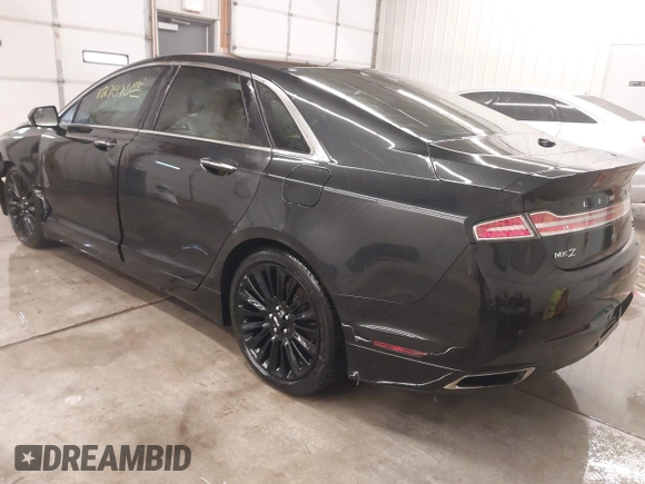 2015 Lincoln MKZ z VIN 3LN6L2J95FR620390, wystawiony jako IAAI lot #41586267 z przebiegiem 127 870 mil mil oraz . Historia ofert i sprzedaży dostępna na DreamBid. Obrazek 3.