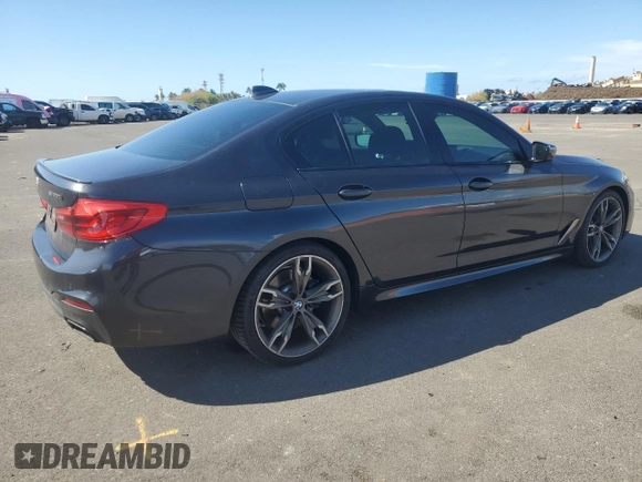 2019 BMW 5 Series M550i xDrive with VIN WBAJB9C57KB289036, listed as a Copart auction lot 86292134 with 28,103 mi miles and Salvage title. Bid and sale history available at DreamBid. Image 3.