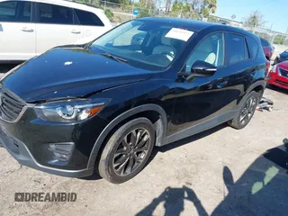 2016 Mazda CX-5 Grand Touring with VIN JM3KE4DY4G0677605, listed as a IAAI auction lot 41642893 with Not Provided miles and . Bid and sale history available at carsss.com. Image 2.