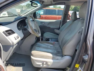 2012 Toyota Sienna XLE AAS with VIN 5TDYK3DC3CS237344, listed as a Copart auction lot 63271815 with 105,860 mi miles and Salvage title. Bid and sale history available at DreamBid. Image 7.