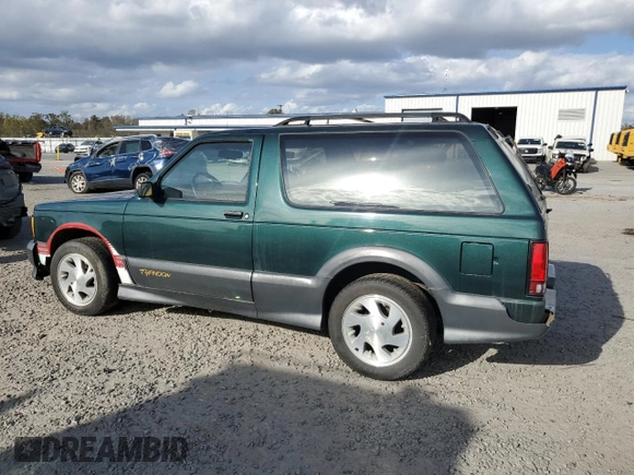 1993 GMC Jimmy z VIN 1GDCT18Z9P0810178, wystawiony jako Copart lot #79442614 z przebiegiem 19 514 mil mil oraz Szkoda całkowita • Salvage title. Historia ofert i sprzedaży dostępna na DreamBid. Obrazek 2.