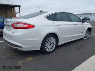 2013 Ford Fusion SE Hybrid with VIN 3FA6P0LUXDR326162, listed as a IAAI auction lot 41538999 with 148,112 mi miles. Bid and sale history available at carsss.com. Image 4.