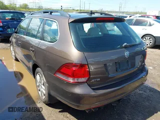 2011 Volkswagen Jetta SportWagen TDI with VIN 3VWPL7AJ2BM672287, listed as a IAAI auction lot 42013933 with 153,378 mi miles. Bid and sale history available at carsss.com. Image 3.