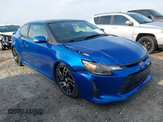 2014 Scion tC with VIN JTKJF5C72E3086001, listed as a IAAI auction lot 41721986 with 207,239 mi miles. Bid and sale history available at carsss.com. Image 1.