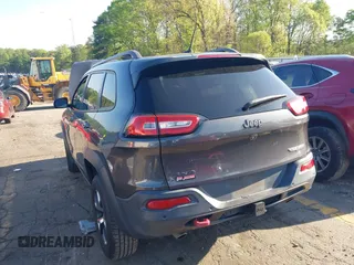 2014 Jeep Cherokee Trailhawk with VIN 1C4PJMBS6EW167517, listed as a IAAI auction lot 41947552 with 233,572 mi miles. Bid and sale history available at carsss.com. Image 3.