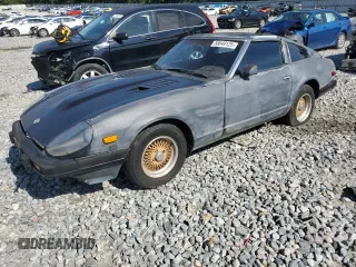 1982 Datsun 280ZX z VIN JN1HZ04S1CX447813, wystawiony jako Copart lot #56649125 z przebiegiem 285 290 mil mil oraz Tytuł czysty. Historia ofert i sprzedaży dostępna na DreamBid. Obrazek 1.