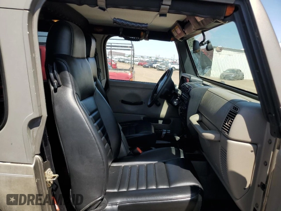 2004 Jeep Wrangler Rubicon with VIN 1J4FA69S64P751349, listed as a Copart auction lot 69642624 with 160,589 mi miles and Salvage Title. Bid and sale history available at carsss.com. Image 10.