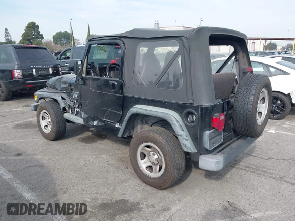 2002 Jeep Wrangler X with VIN 1J4FA39S92P774054, listed as a IAAI auction lot 41470351 with 209,727 mi miles. Bid and sale history available at carsss.com. Image 3.