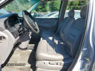 2003 Honda Odyssey EX-L z VIN 5FNRL18903B007639, wystawiony jako Copart lot #57230975 z przebiegiem 189 235 mil mil oraz Szkoda całkowita • Salvage title. Historia ofert i sprzedaży dostępna na DreamBid. Obrazek 7.