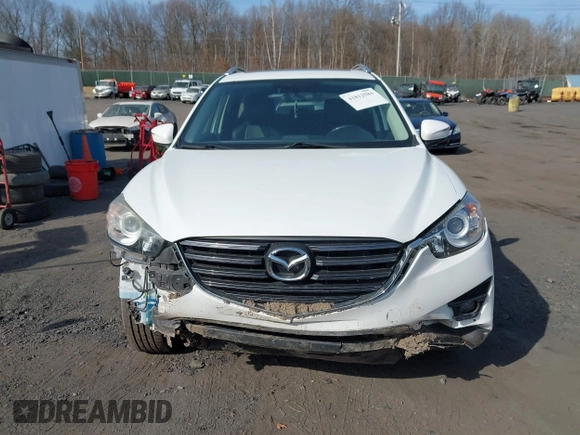 2016 Mazda CX-5 Grand Touring with VIN JM3KE4DYXG0836692, listed as a IAAI auction lot 41812584 with 119,302 mi miles. Bid and sale history available at carsss.com. Image 12.