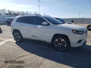 2019 Jeep Cherokee Overland with VIN 1C4PJMJN3KD173830, listed as a Copart auction lot 87229794 with 82,433 mi miles and Salvage title. Bid and sale history available at DreamBid. Image 4.