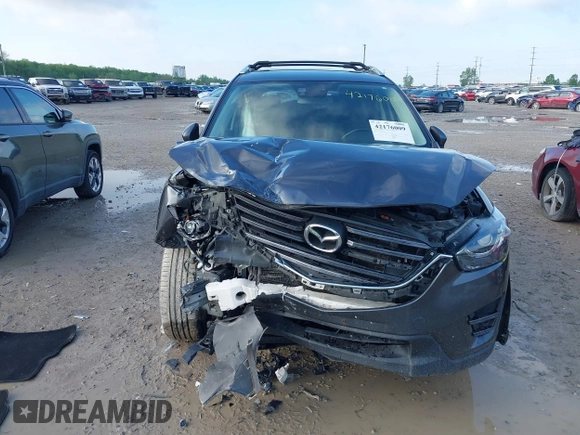 2016 Mazda CX-5 Grand Touring with VIN JM3KE4DYXG0724183, listed as a IAAI auction lot 42176009 with 152,695 mi miles and . Bid and sale history available at DreamBid. Image 12.