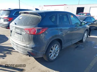 2014 Mazda CX-5 Grand Touring with VIN JM3KE2DY1E0421326, listed as a IAAI auction lot 41330794 with 127,589 mi miles. Bid and sale history available at carsss.com. Image 4.