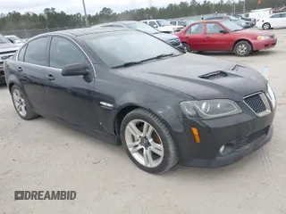 2009 Pontiac G8 with VIN 6G2ER57789L232134, listed as a IAAI auction lot 41864803 with 166,717 mi miles. Bid and sale history available at carsss.com. Image 1.