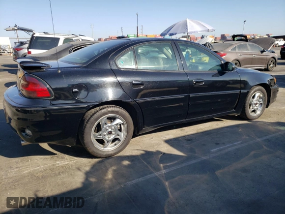 2002 Pontiac Grand Am GT with VIN 1G2NW52E12M704539, listed as a Copart auction lot 73755214 with 100,904 mi miles and Clean Title. Bid and sale history available at carsss.com. Image 3.