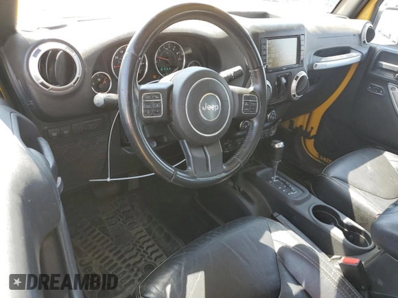 2015 Jeep Wrangler Rubicon Hard Rock with VIN 1C4BJWCG6FL568665, listed as a Copart auction lot 60282155 with 107,773 mi miles and Salvage title. Bid and sale history available at DreamBid. Image 8.