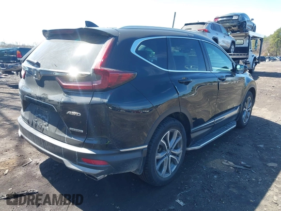 2020 Honda CR-V Touring with VIN 2HKRW2H98LH660573, listed as a IAAI auction lot 41524610 with 37,493 mi miles and . Bid and sale history available at DreamBid. Image 4.