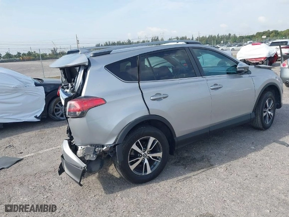 2018 Toyota RAV4 XLE with VIN 2T3WFREV5JW407424, listed as a IAAI auction lot 41869290 with 111,413 mi miles. Bid and sale history available at carsss.com. Image 4.