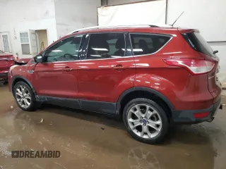 2016 Ford Escape Titanium with VIN 1FMCU9J95GUC57205, listed as a Copart auction lot 71033934 with 90,477 mi miles and Salvage Title. Bid and sale history available at DreamBid. Image 2.