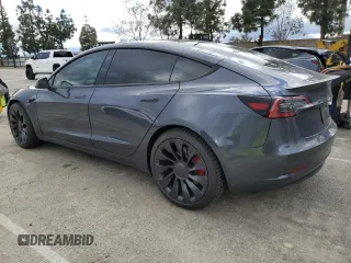 2023 Tesla Model 3 Performance with VIN 5YJ3E1EC9PF633549, listed as a Copart auction lot 48908755 with 23,034 mi miles and Salvage Title. Bid and sale history available at carsss.com. Image 2.