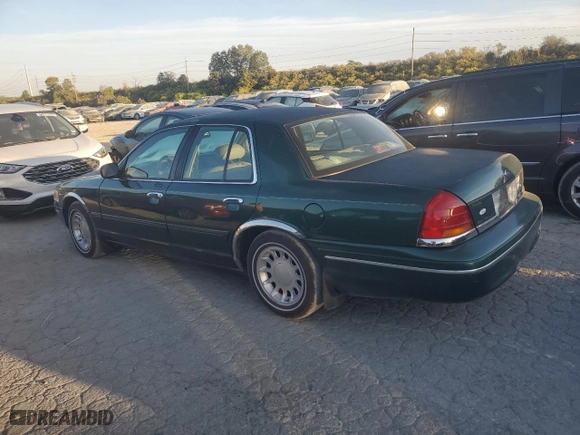 2000 Ford Crown Victoria LX with VIN 2FAFP74W9YX146624, listed as a Copart auction lot 77495074 with 167,594 mi miles and Salvage Title. Bid and sale history available at carsss.com. Image 2.