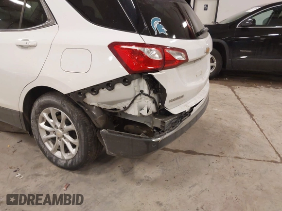 2018 Chevrolet Equinox LT z VIN 2GNAXSEV7J6138909, wystawiony jako IAAI lot #41295974 z przebiegiem 68 852 mil mil oraz . Historia ofert i sprzedaży dostępna na DreamBid. Obrazek 6.