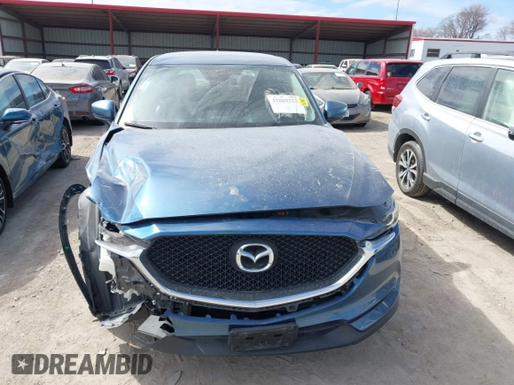 2018 Mazda CX-5 Sport with VIN JM3KFBBM8J0400741, listed as a IAAI auction lot 41860323 with 54,911 mi miles. Bid and sale history available at carsss.com. Image 12.