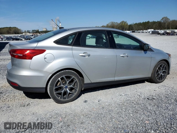 2017 Ford Focus SE with VIN 1FADP3FE0HL336863, listed as a Copart auction lot 50493435 with 64,451 mi miles and Clean Title. Bid and sale history available at DreamBid. Image 3.