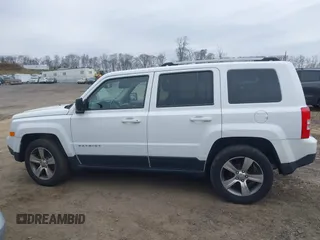 2016 Jeep Patriot High Altitude Edition with VIN 1C4NJRFB3GD753248, listed as a IAAI auction lot 42005423 with 165,229 mi miles. Bid and sale history available at carsss.com. Image 14.